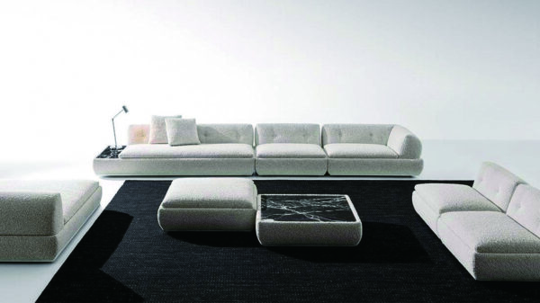 Sectional fabric sofa with the seat cushions and marble or wood tops