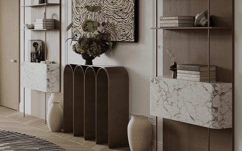 a modern foyer with a sculptural console and marble floating shelves