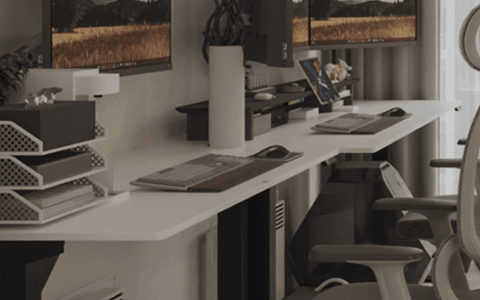 modern home office featuring a dual monitor standing desk setup