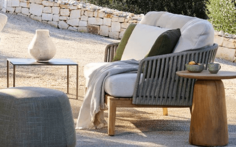 modern patio armchair with a rope back and wood frame
