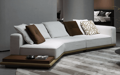 modern sectional sofa with a built-in wood side table