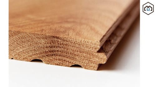 A close-up view of solid hardwood flooring showing its natural grain