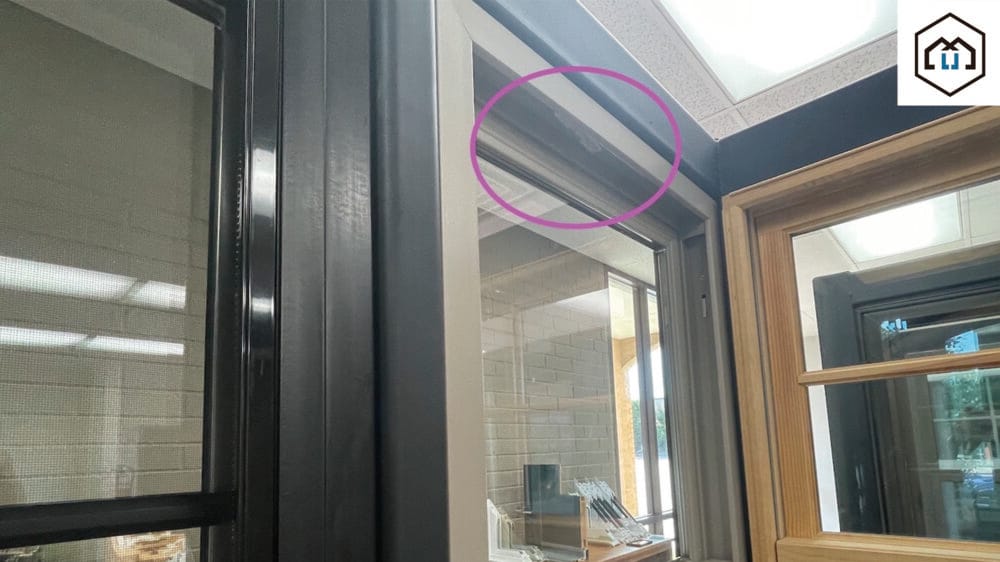 To identify a windows manufacturer, check its hardware, like the circle lock, for a brand name