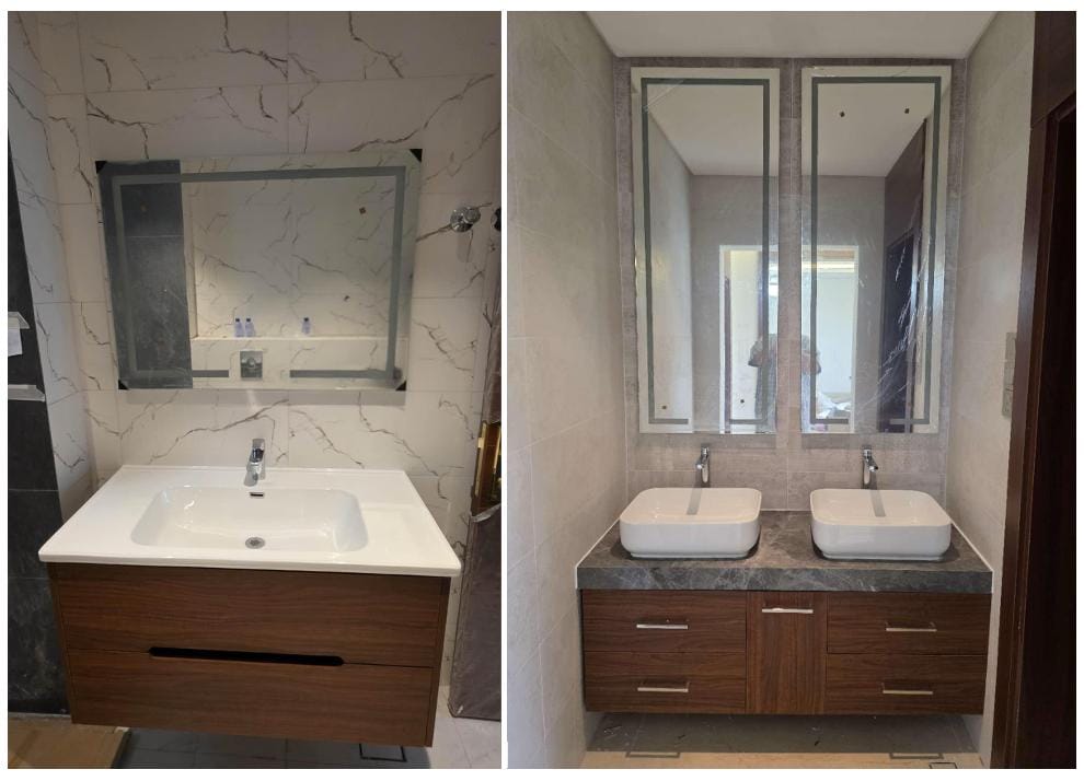 Modern bathroom with double sink and illuminated mirror