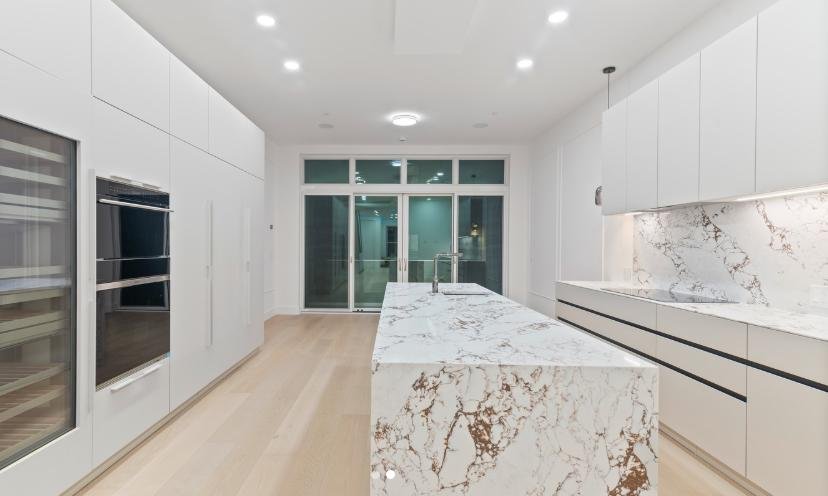 Galley Kitchen With Island Marble Countertop