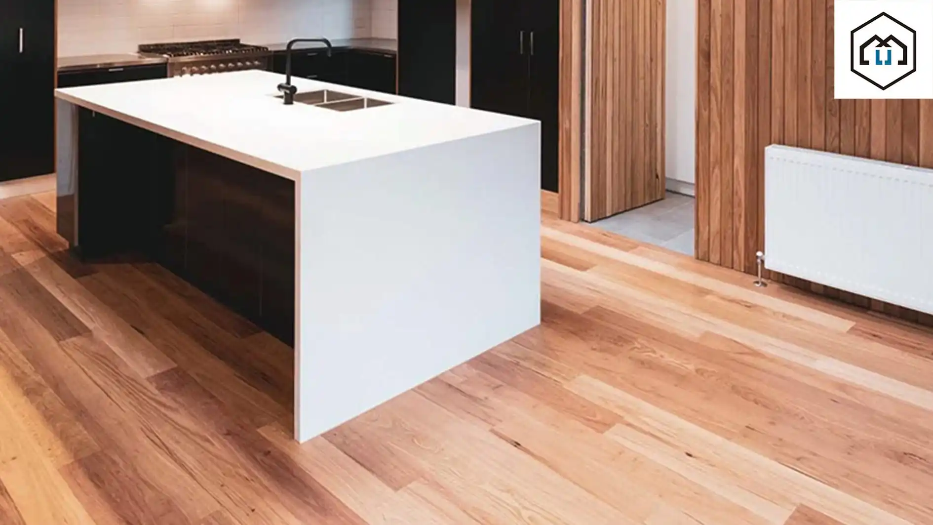 A kitchen with eco-friendly sustainable flooring and a white kitchen island